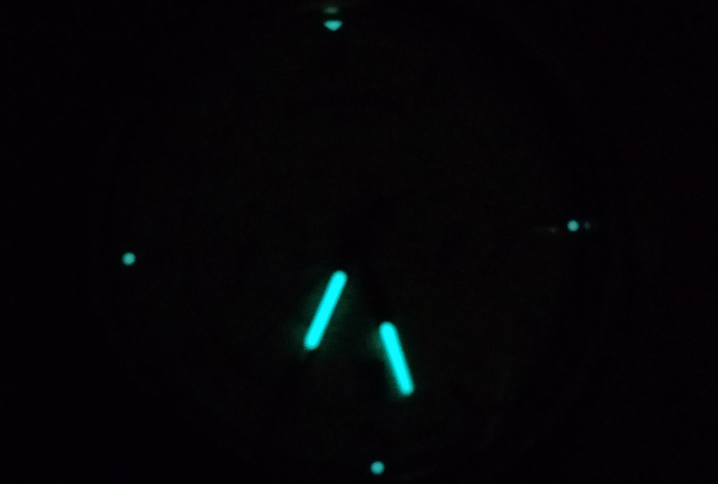 Showing the lume of Kuruvakka RAE-3 wristwatch. Lume in hands and in indexes 12, 3, 6 and 9 O'clock.