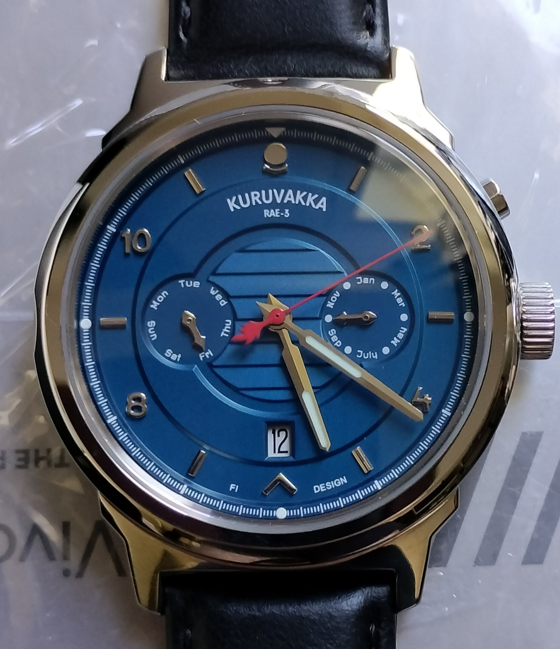 Kuruvakka wristwatch front faced in dimmer lighting